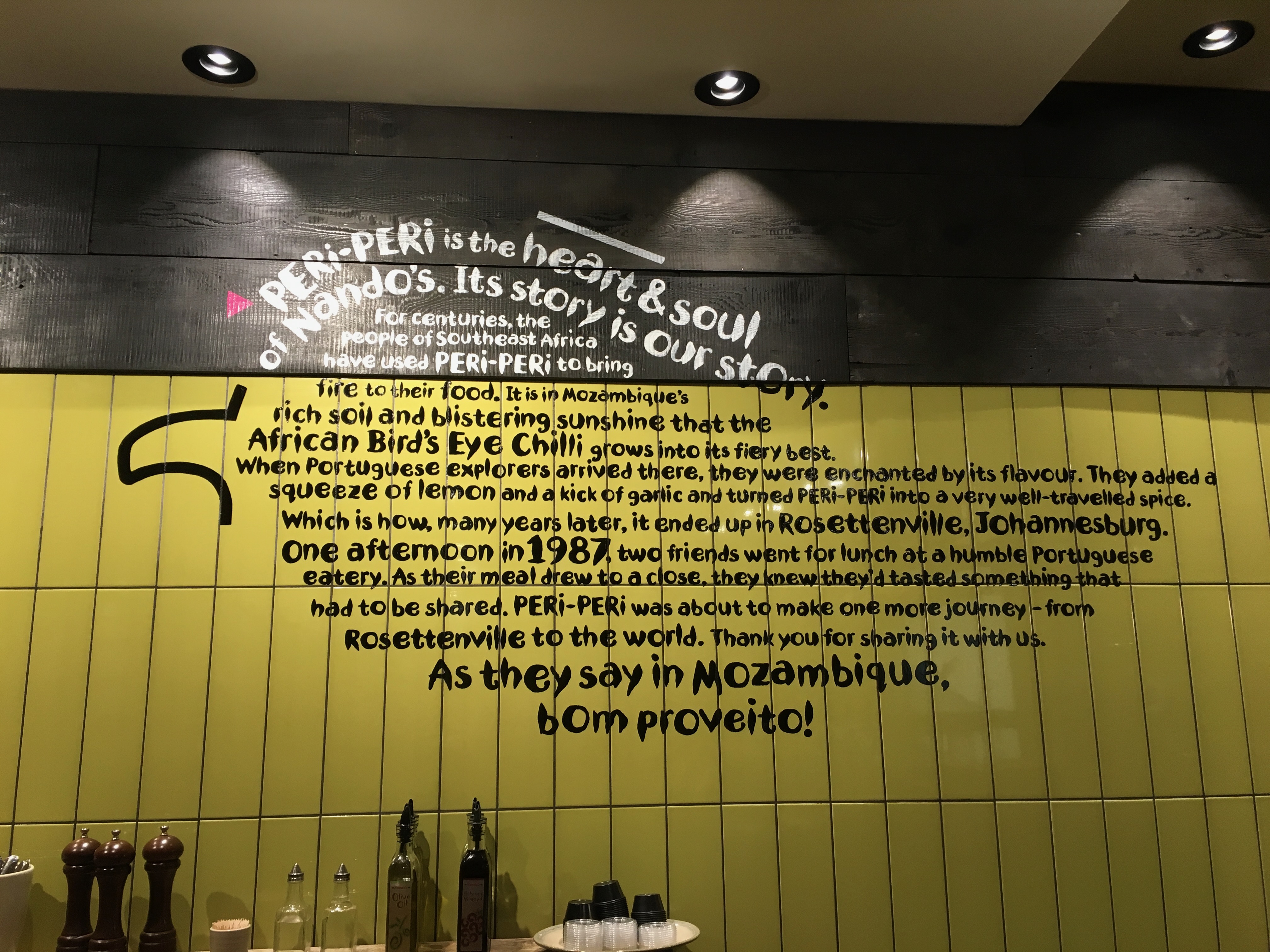 Hand-lettered Legend of the Barcelos Cockerel mural at Nandos