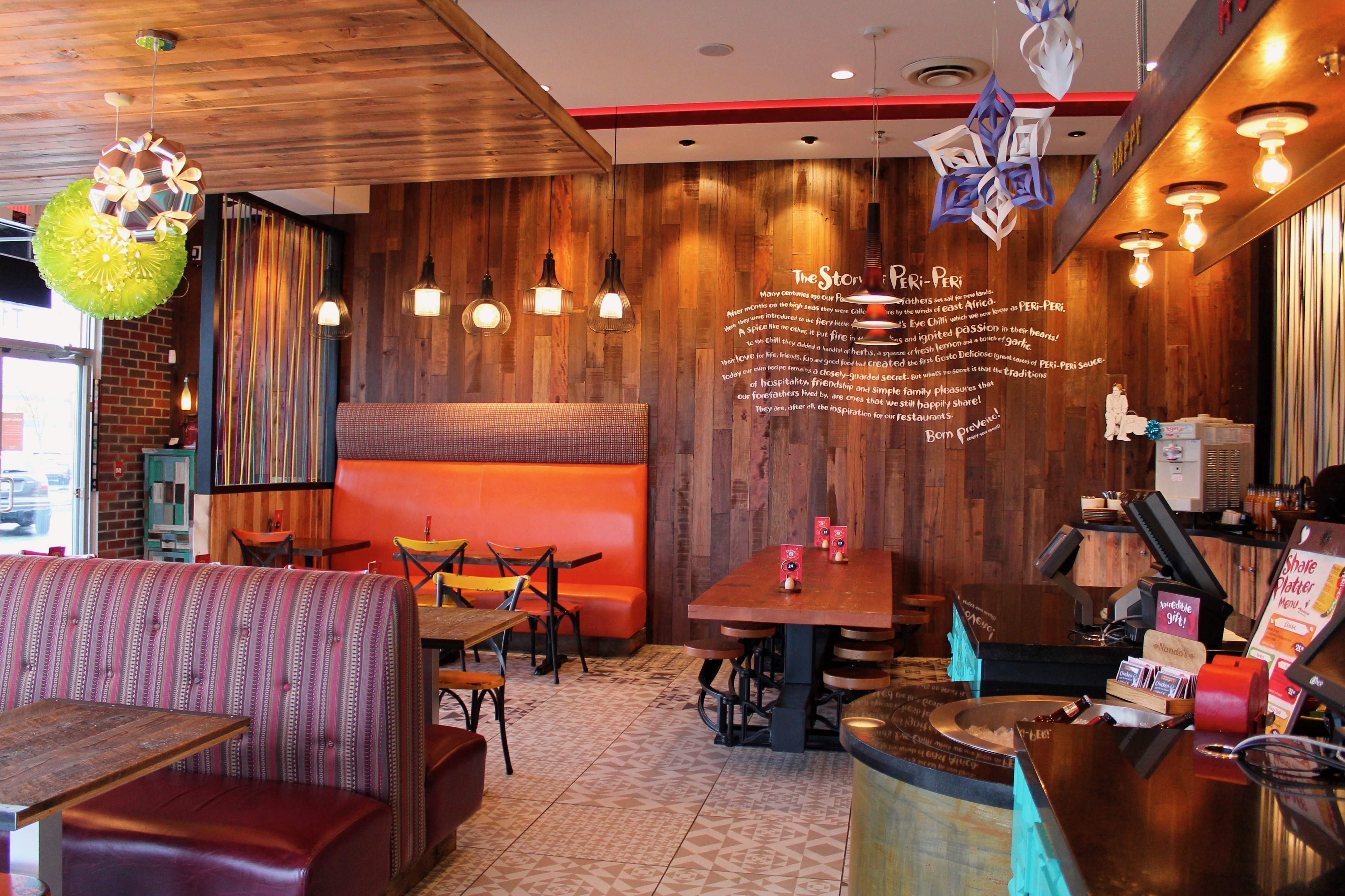 Completed custom wall artwork in a Nandos dining room